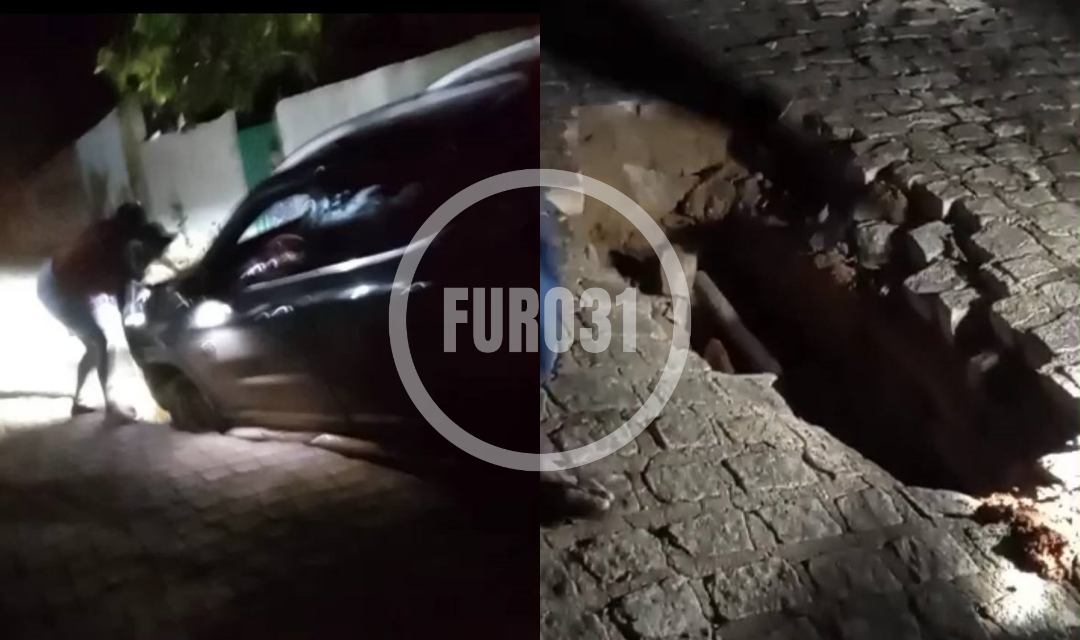 Carro cai em buraco aberto na rua de Cajuíta, povoado de Guaratinga; veja o vídeo